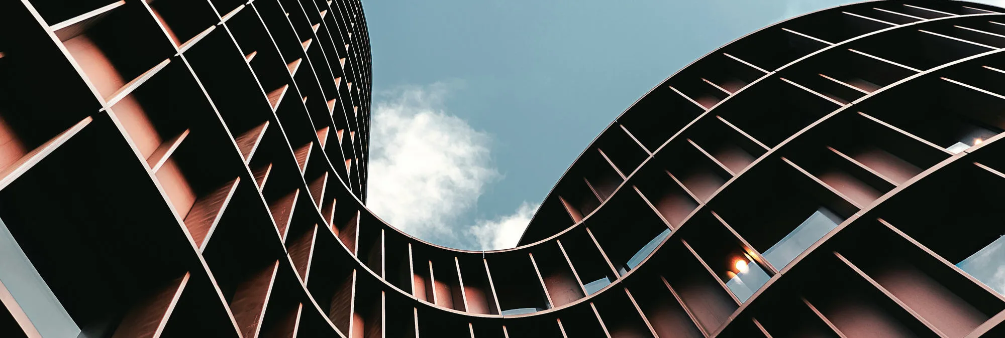 Curved architectural facade against the sky